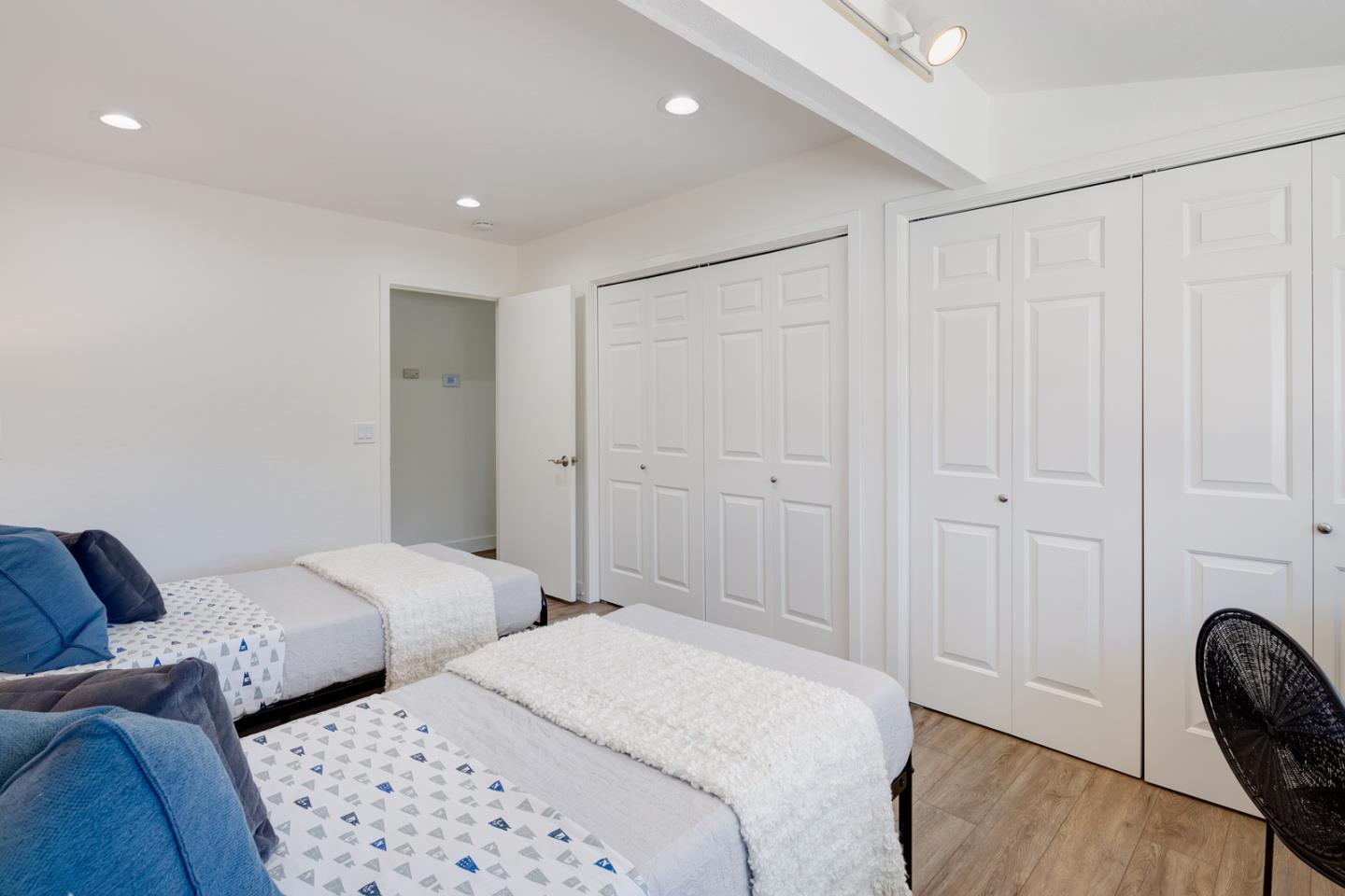 1650 Manitoba Drive Sunnyvale, CA 94087 - Photo 23 of 26 a bedroom with two beds and a chair