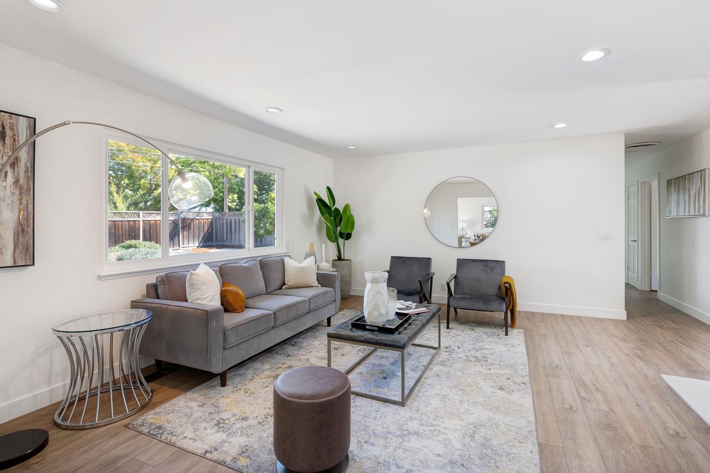 1650 Manitoba Drive Sunnyvale, CA 94087 - Photo 6 of 26 a living room with furniture a table and a large window