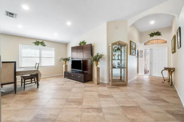 a view of a livingroom with furniture and a flat screen tv
