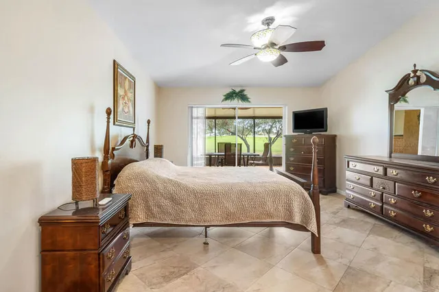 a bedroom with a bed and a television