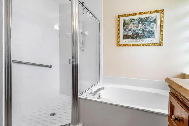 a bathroom with a tub and shower