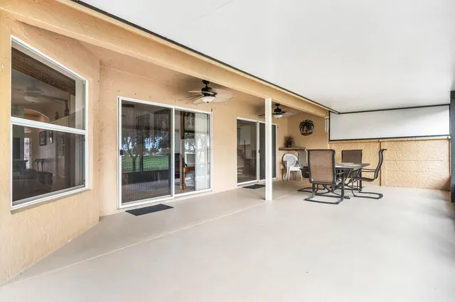 a view of a entryway with a dinning table and chairs