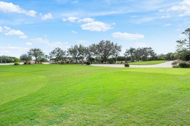 a view of a golf course with a lake