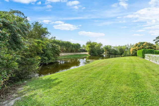 a view of lake with green space