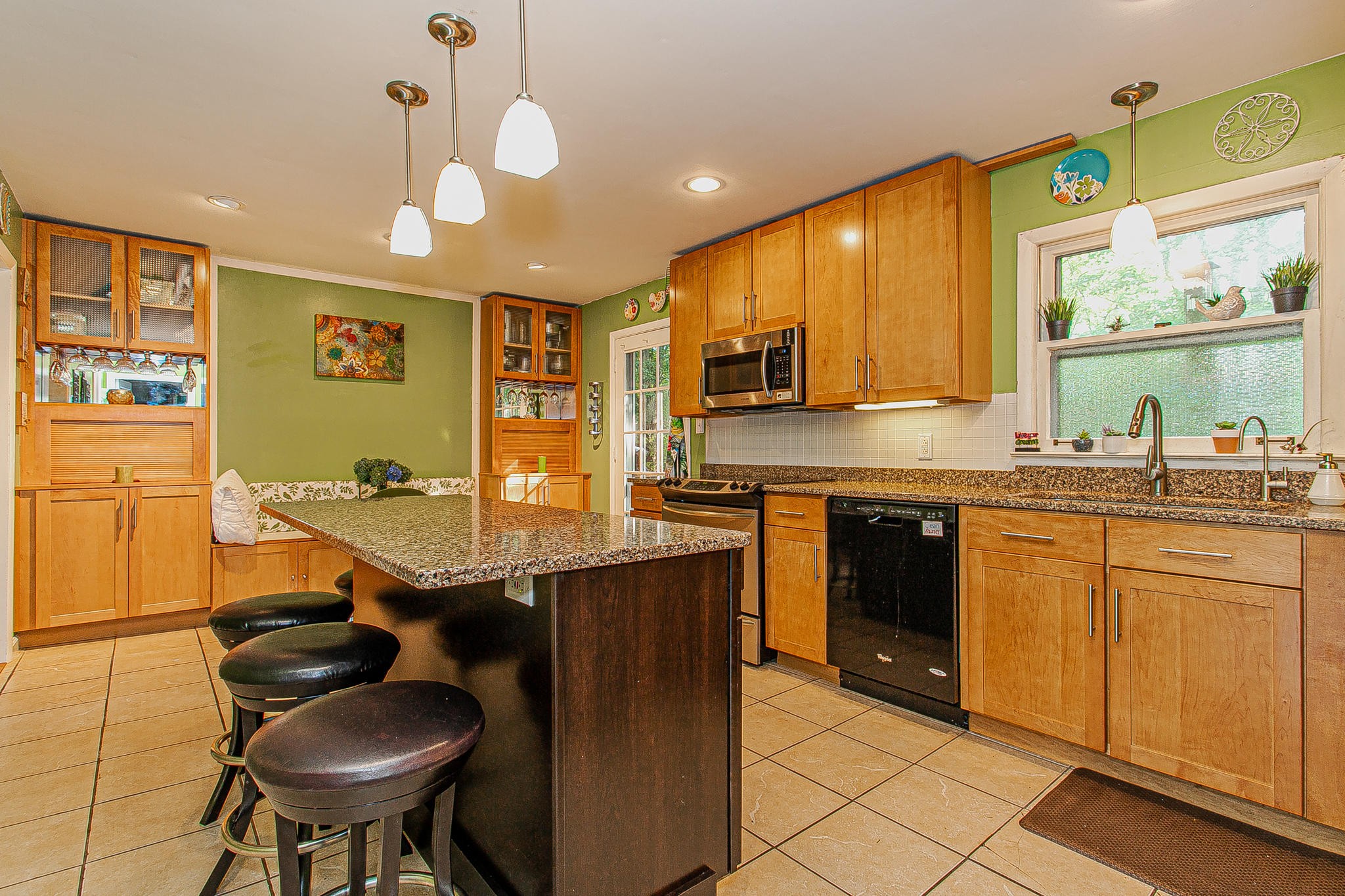 4409 Deerfield Road Knoxville, TN 37921 - Photo 11 of 40 a kitchen with stainless steel appliances granite countertop a sink and a refrigerator