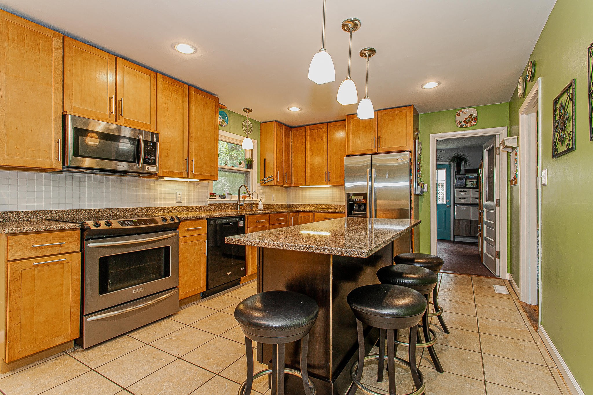 4409 Deerfield Road Knoxville, TN 37921 - Photo 14 of 40 a kitchen with a sink cabinets and stainless steel appliances