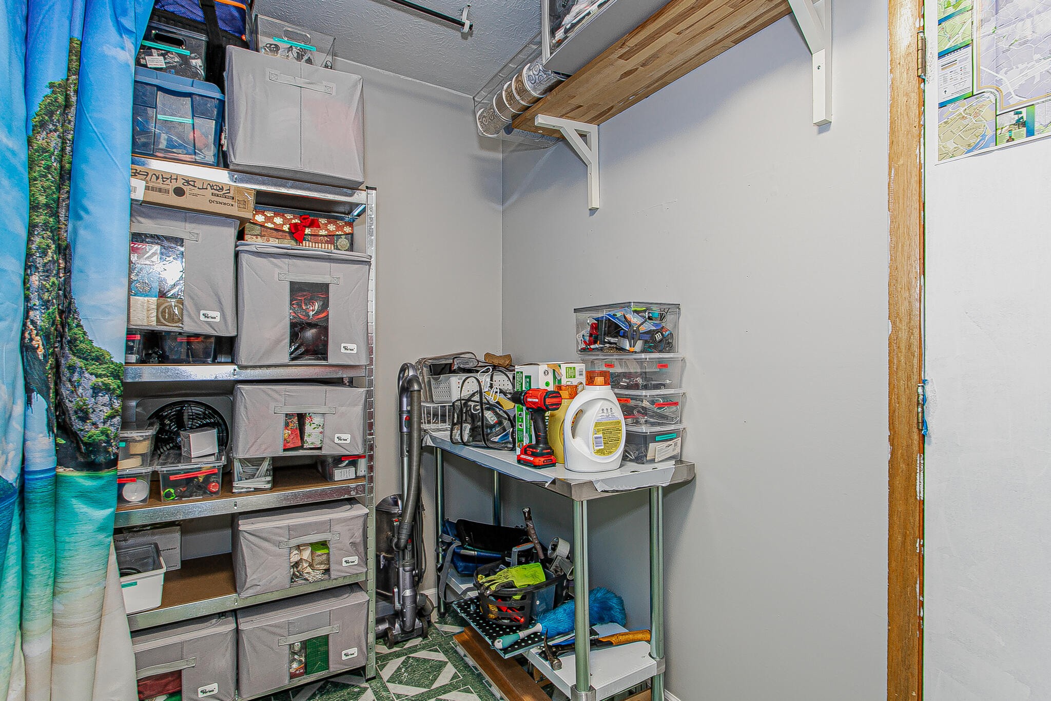 4409 Deerfield Road Knoxville, TN 37921 - Photo 17 of 40 a utility room with fridge dryer and bicycles
