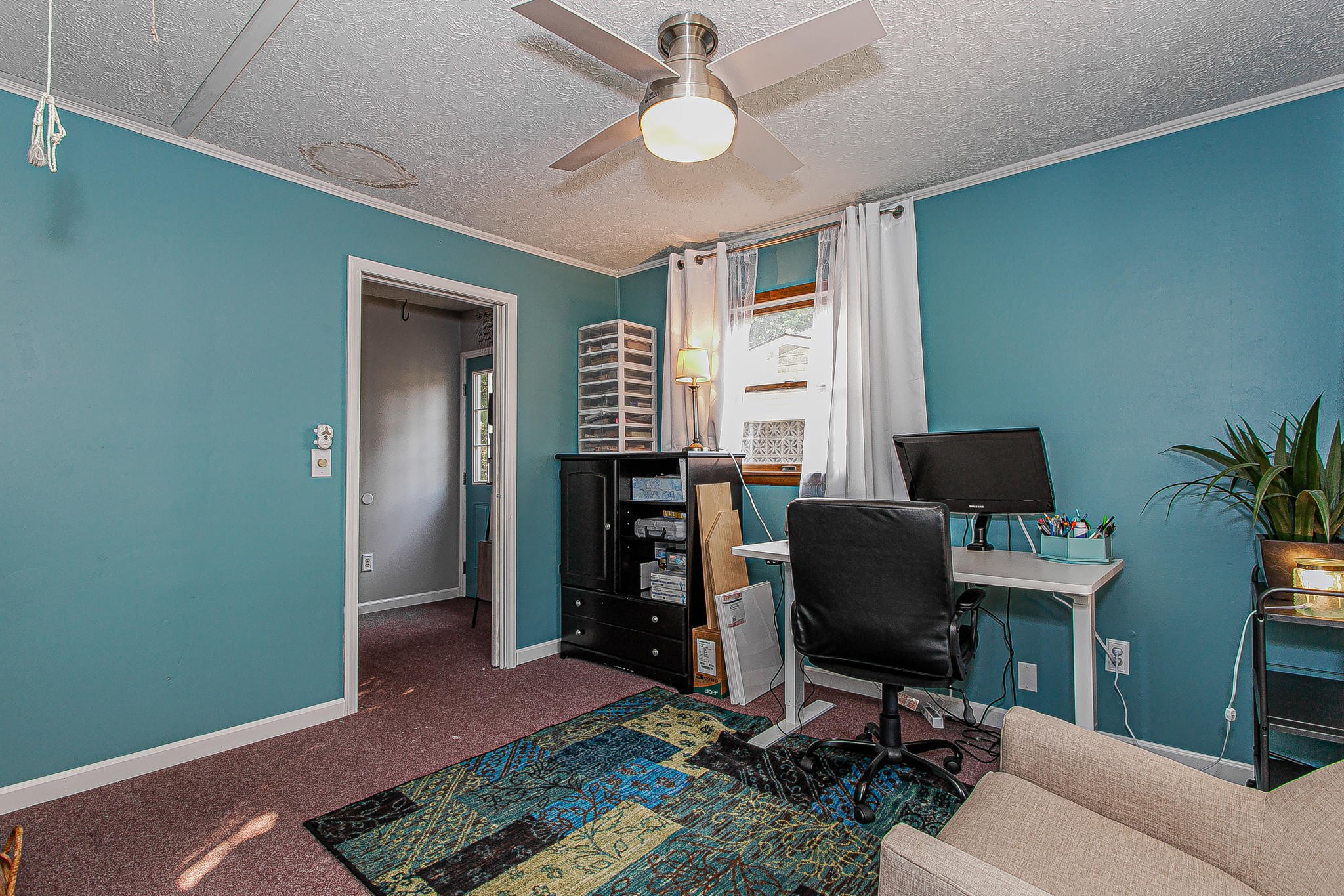 4409 Deerfield Road Knoxville, TN 37921 - Photo 28 of 40 a view of a workspace with furniture and a window