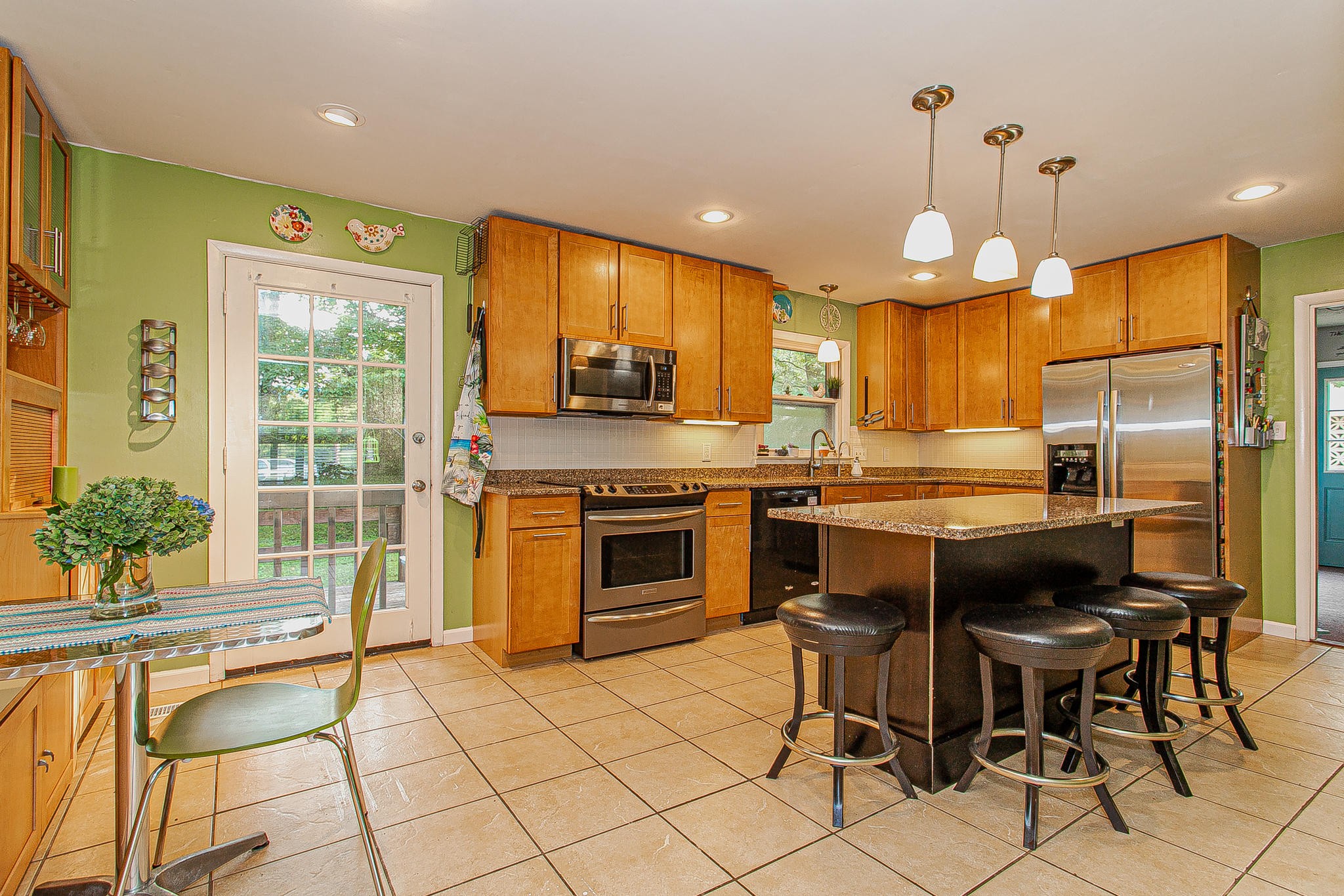4409 Deerfield Road Knoxville, TN 37921 - Photo 10 of 40 a kitchen with a stove a sink and a refrigerator