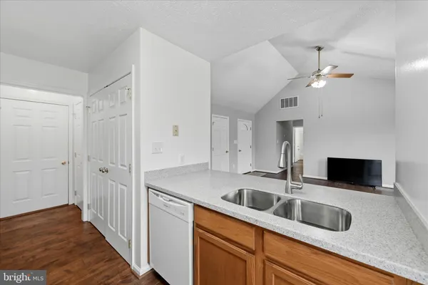 a kitchen with sink cabinets and window