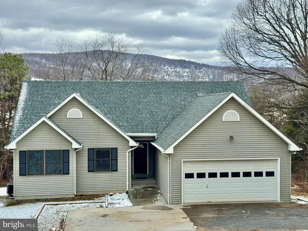 a view of a park with iron fence