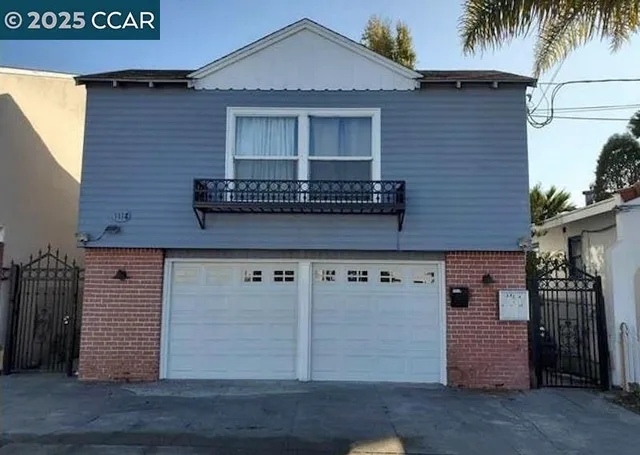 a front view of a house with garage