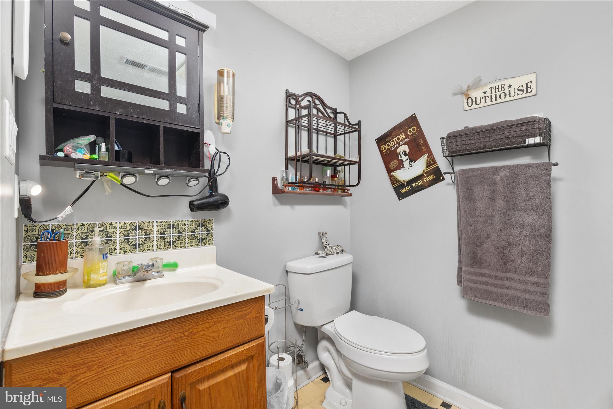 132 Stadium Circle Inwood, WV 25428 - Photo 20 of 25 a bathroom with a toilet sink and mirror