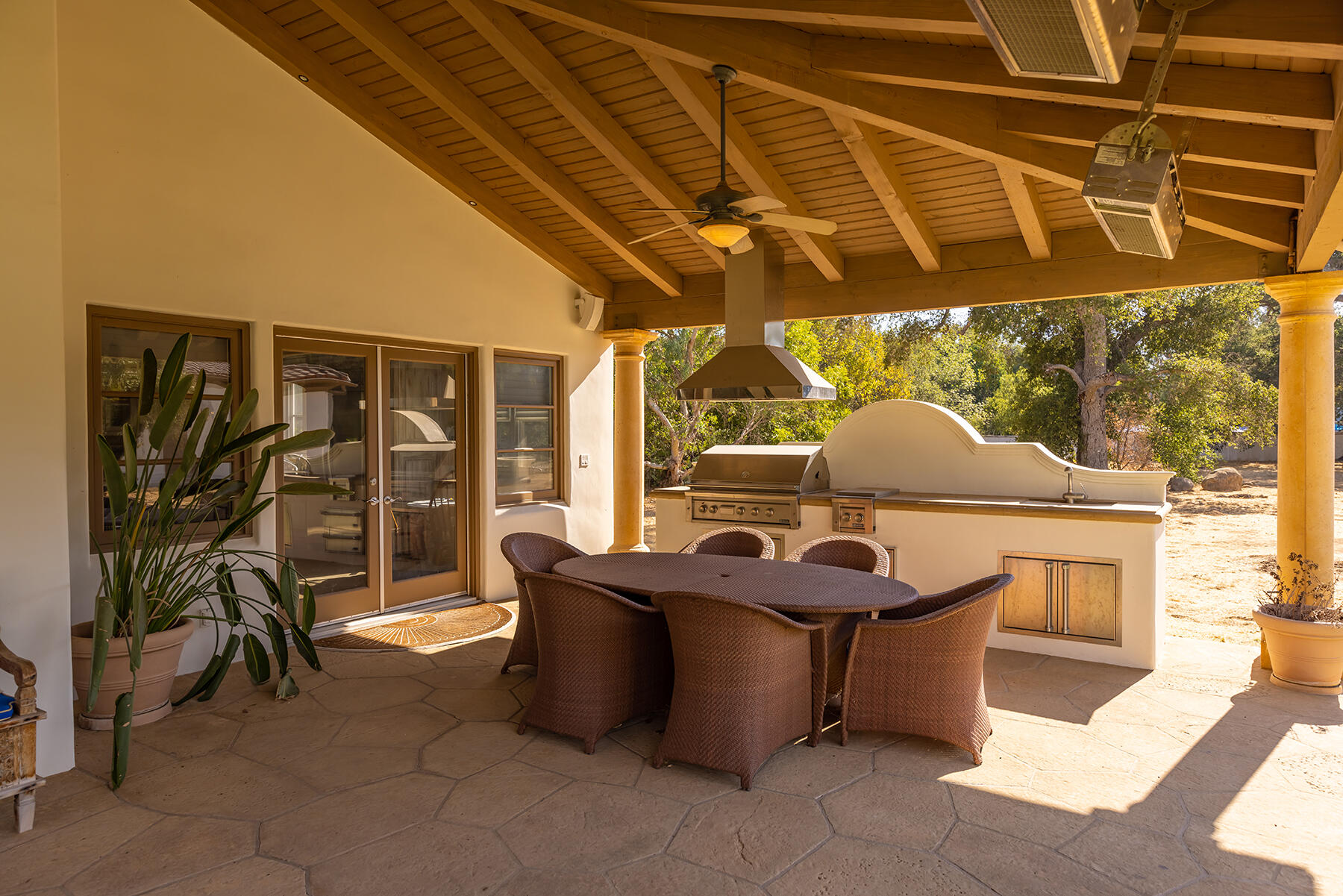 1000 Shokat Drive Ojai, CA 93023 - Photo 21 of 55 a view of a patio with table and chairs and potted plants