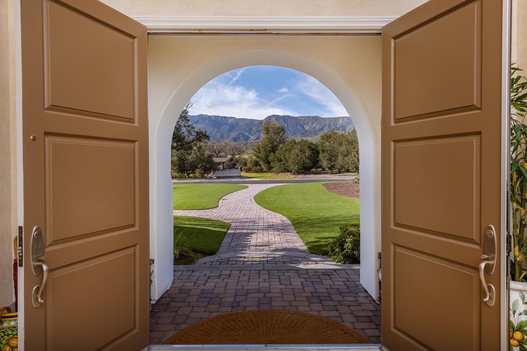 1000 Shokat Drive Ojai, CA 93023 - Photo 3 of 55 a view of open kitchen with a refrigerator a fireplace a sink and a yard