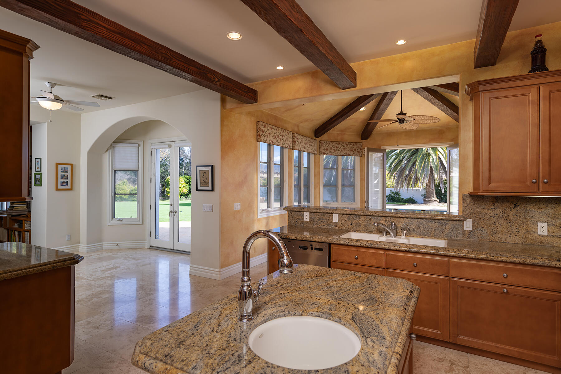 1000 Shokat Drive Ojai, CA 93023 - Photo 4 of 55 a kitchen with stainless steel appliances granite countertop a sink a stove and a dining table with wooden floor