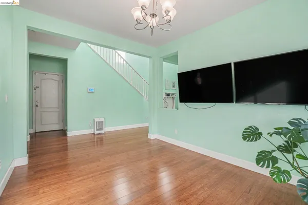a view of a livingroom with an empty kitchen