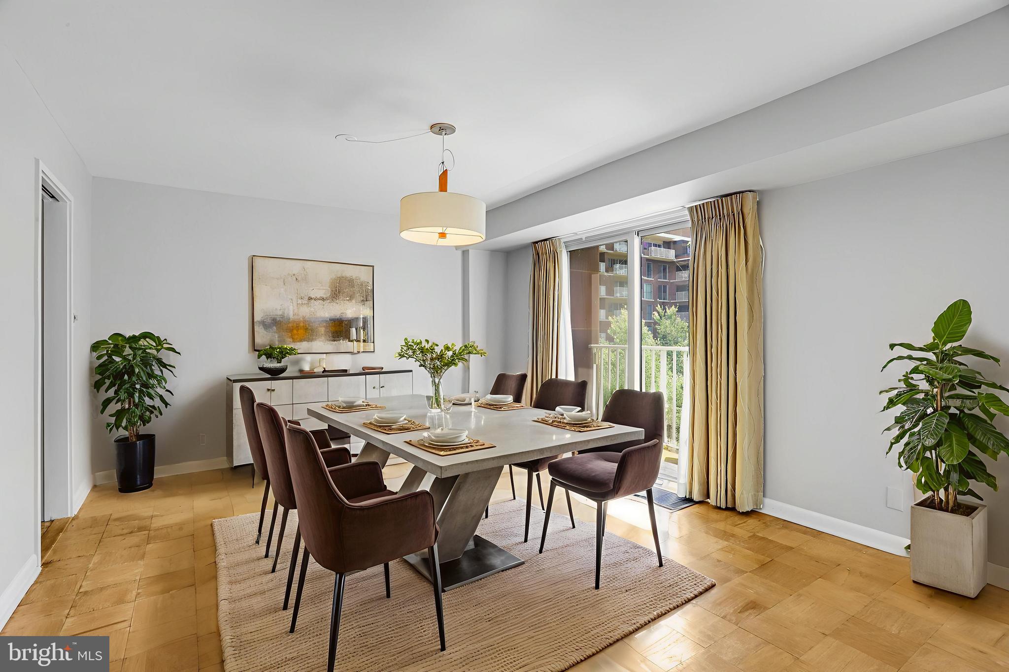 510 N Street Southwest, Unit N217 Washington, DC 20024 - Photo 4 of 16 a view of a dining room with furniture window and wooden floor