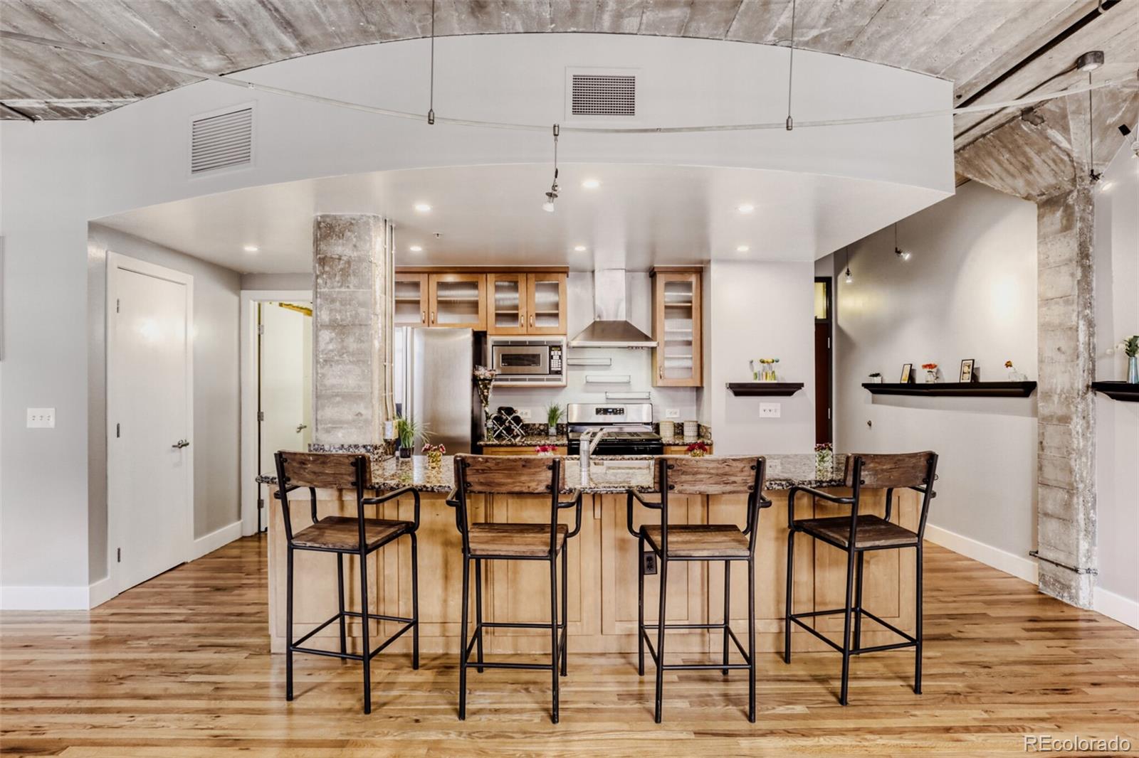1449 Wynkoop Street, Unit 506 Denver, CO 80202 - Photo 12 of 39 a view of a kitchen with dining area