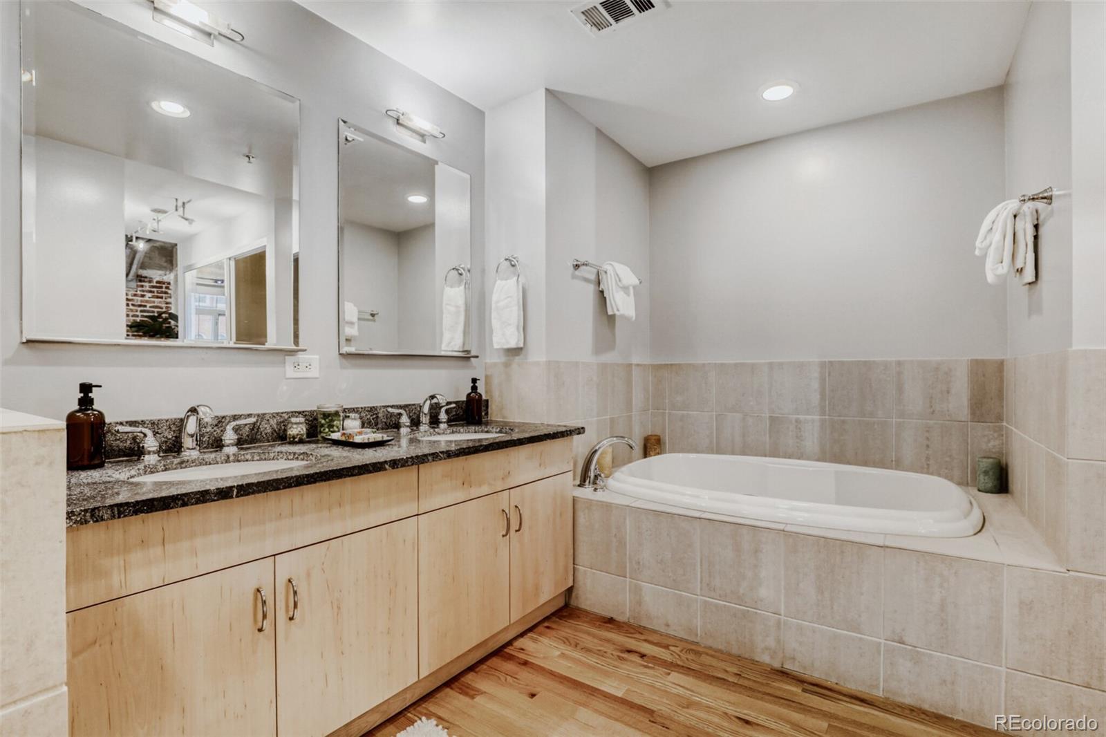 1449 Wynkoop Street, Unit 506 Denver, CO 80202 - Photo 15 of 39 a bathroom with a bathtub and a sink