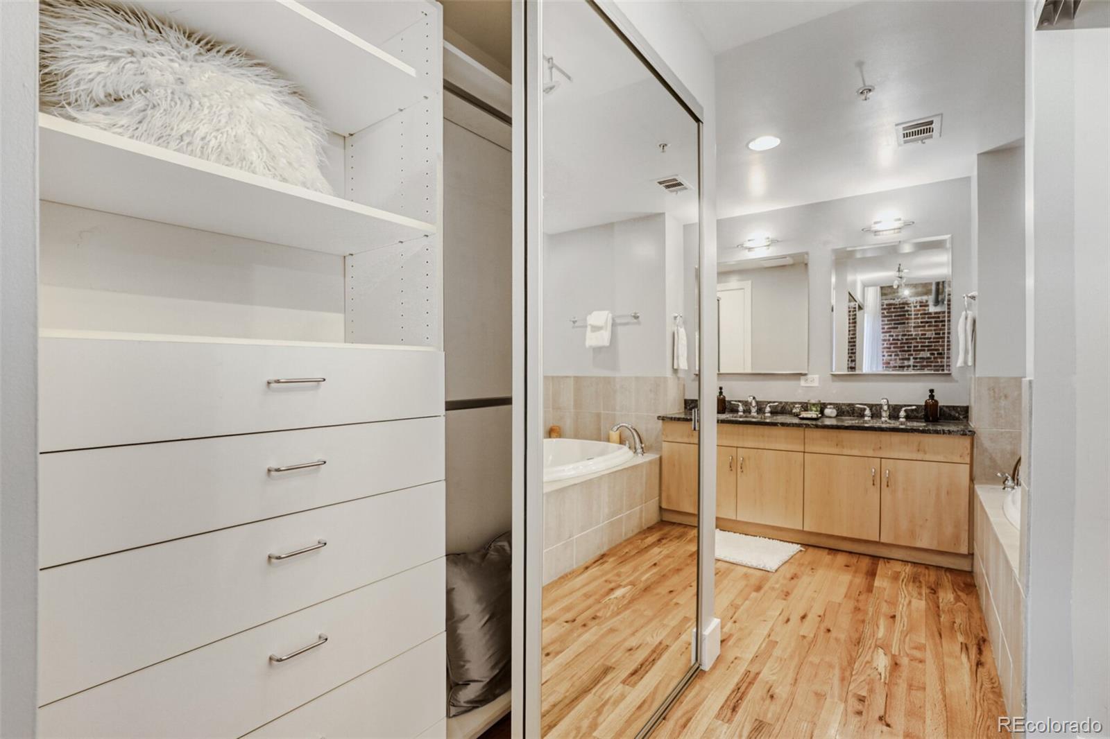 1449 Wynkoop Street, Unit 506 Denver, CO 80202 - Photo 18 of 39 a large white kitchen with dishwasher a stove and a refrigerator