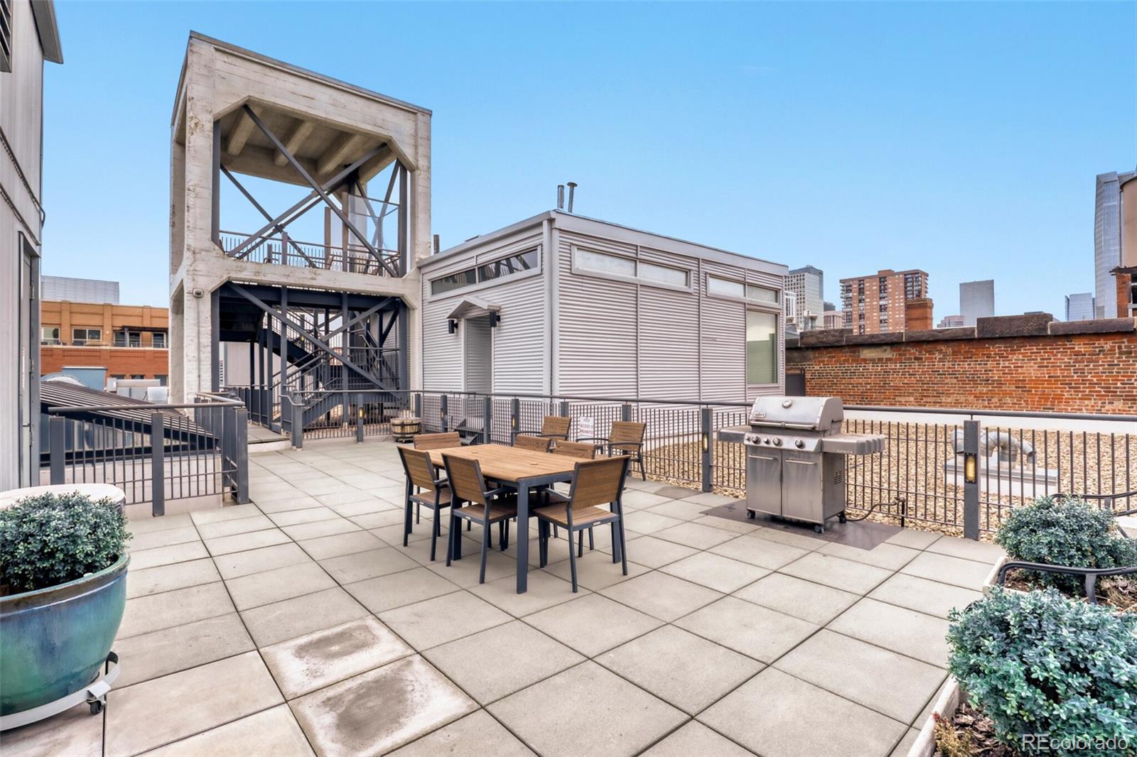 1449 Wynkoop Street, Unit 506 Denver, CO 80202 - Photo 20 of 39 a view of a dinning table and chairs in the patio