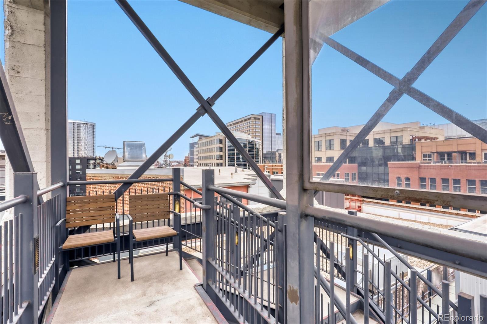 1449 Wynkoop Street, Unit 506 Denver, CO 80202 - Photo 21 of 39 a view of an chairs and deck in the balcony