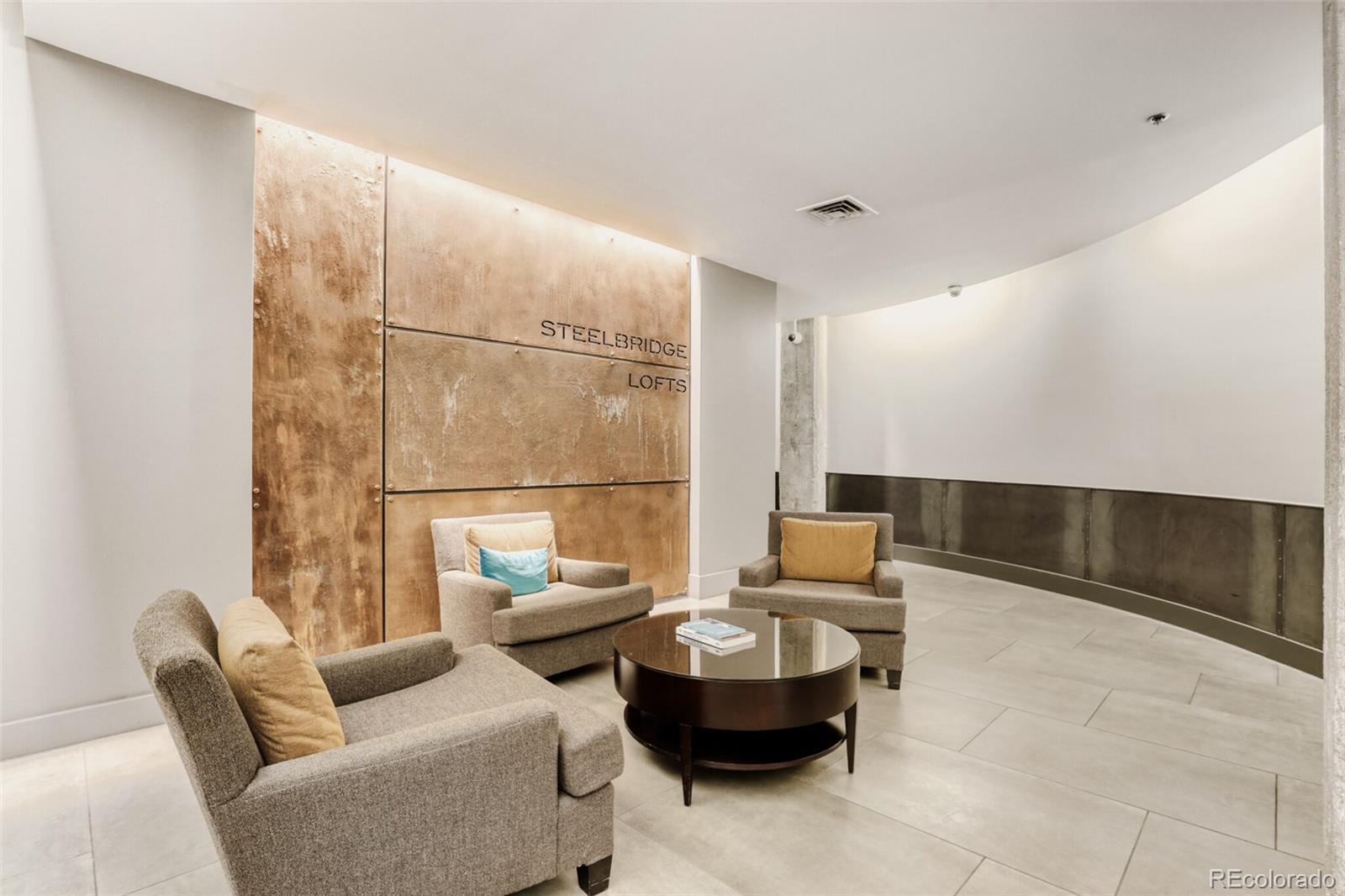 1449 Wynkoop Street, Unit 506 Denver, CO 80202 - Photo 24 of 39 a living room with furniture and a large window