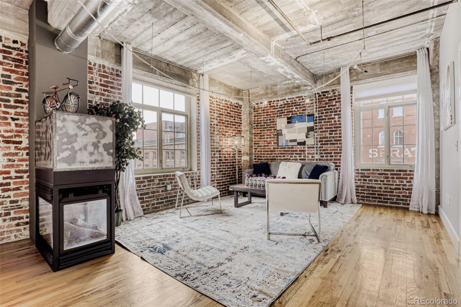 1449 Wynkoop Street, Unit 506 Denver, CO 80202 - Photo 10 of 39 a living room with furniture