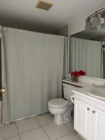 a bathroom with a toilet and a sink