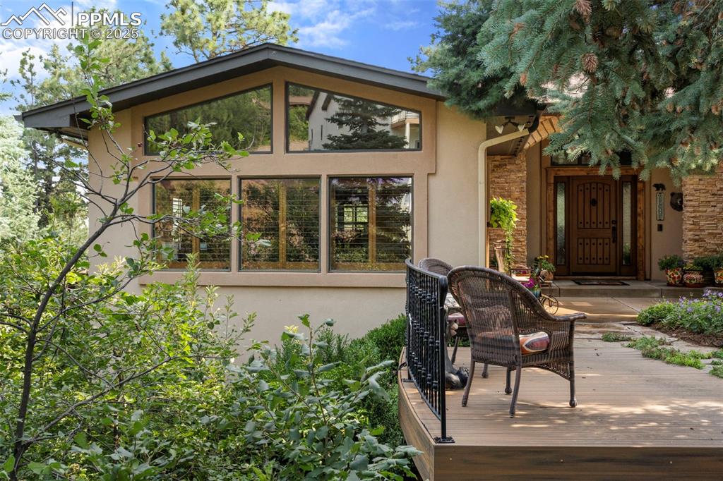 40 Upland Road Colorado Springs, CO 80906 - Photo 1 of 46 a view of a chair and table in the back yard of the house