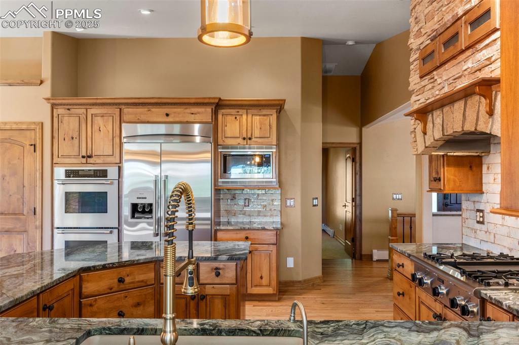 40 Upland Road Colorado Springs, CO 80906 - Photo 14 of 46 a kitchen with table and chairs