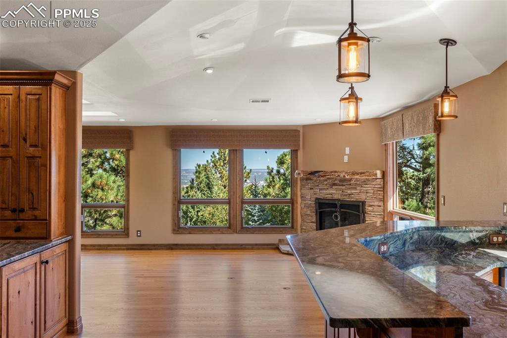 40 Upland Road Colorado Springs, CO 80906 - Photo 18 of 46 a living room with furniture and a fireplace