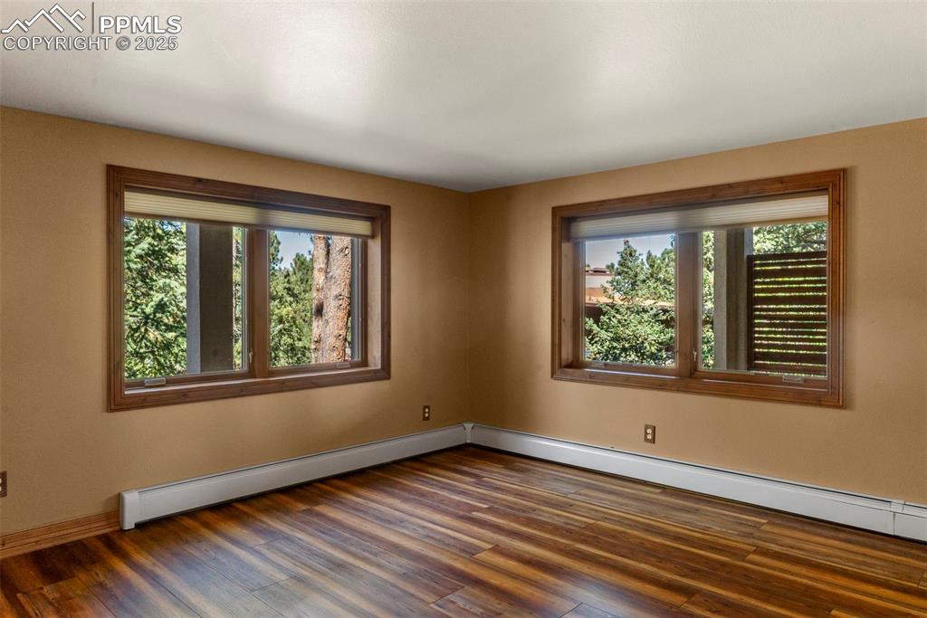 40 Upland Road Colorado Springs, CO 80906 - Photo 29 of 46 a view of an empty room with wooden floor and a window
