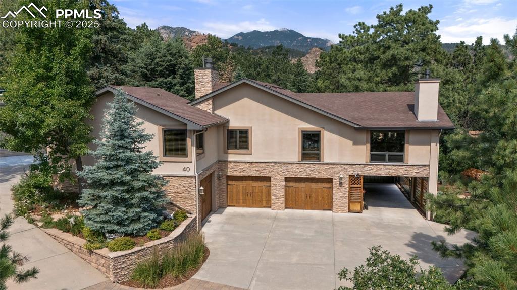 40 Upland Road Colorado Springs, CO 80906 - Photo 41 of 46 a front view of a house with a yard and garage