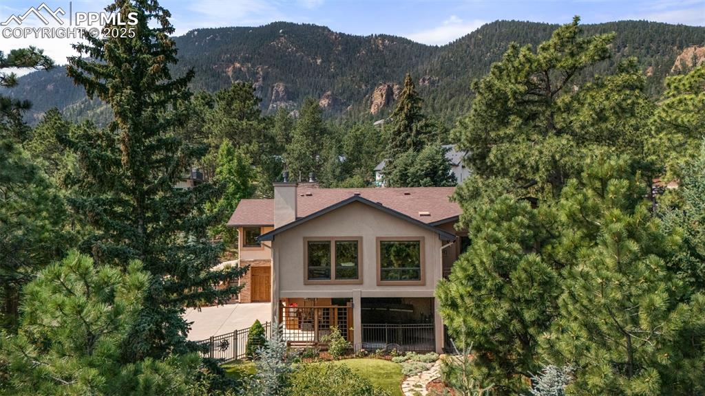 40 Upland Road Colorado Springs, CO 80906 - Photo 43 of 46 a house with trees in the background