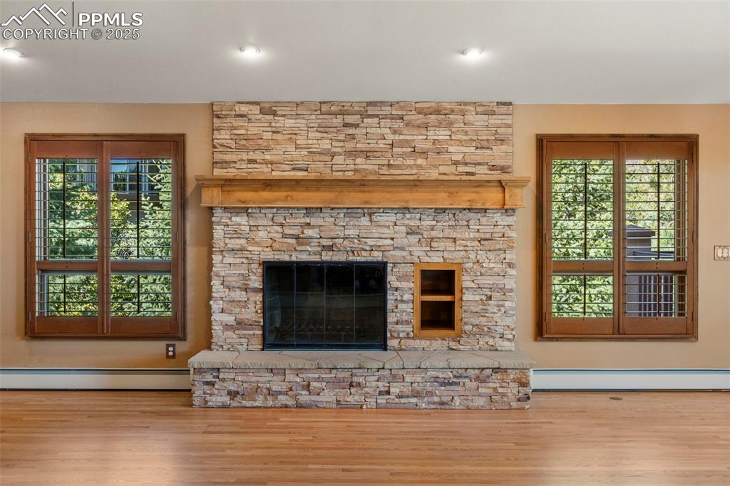 40 Upland Road Colorado Springs, CO 80906 - Photo 7 of 46 a living room with fireplace furniture and a large window