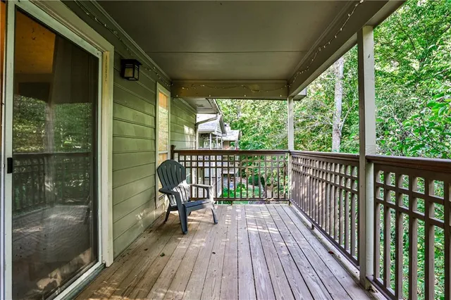 a view of a balcony with chairs
