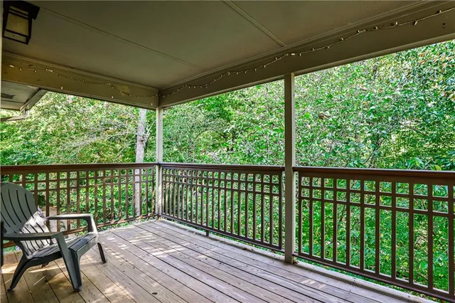 a view of a balcony with wooden floor
