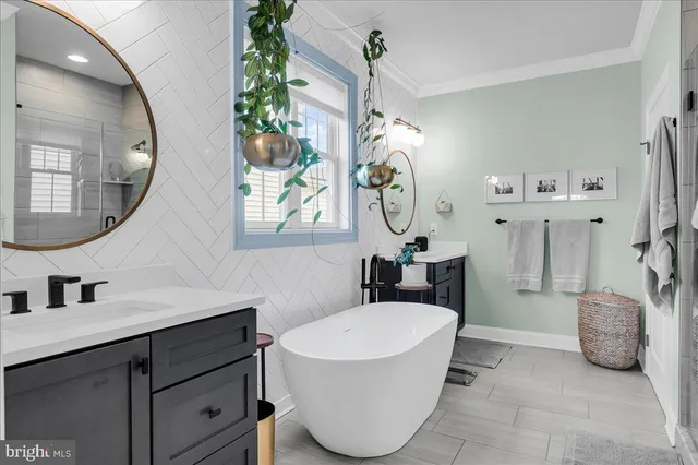 a spacious bedroom with a bed and a flat screen tv