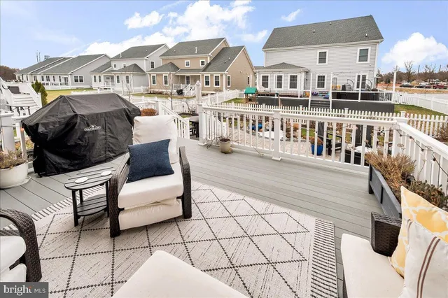 a view of a house with swimming pool and sitting area