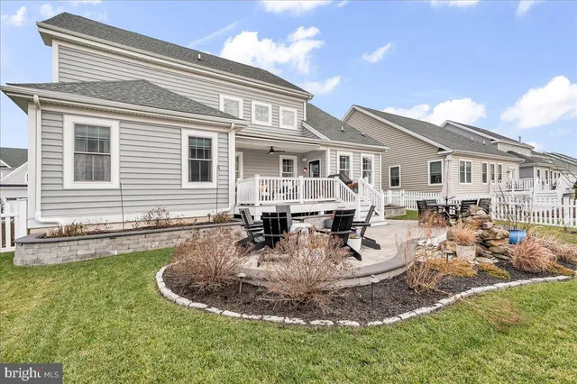a view of a house with outdoor seating