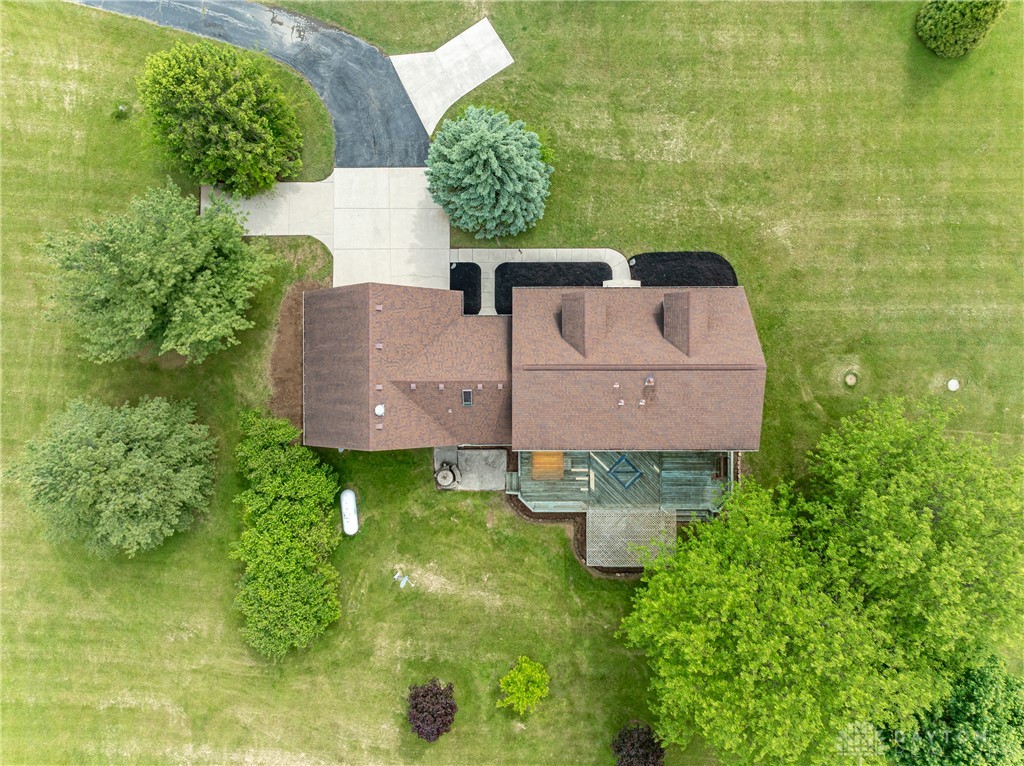 9981 Ridge Acres Lane Englewood, OH 45322 - Photo 63 of 73 An overhead perspective reveals the home's rooflines, expansive lawn, and surrounding mature trees.