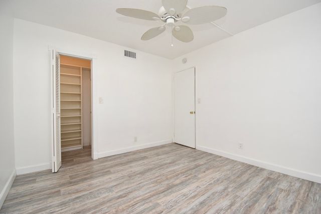 a view of closet area with empty racks