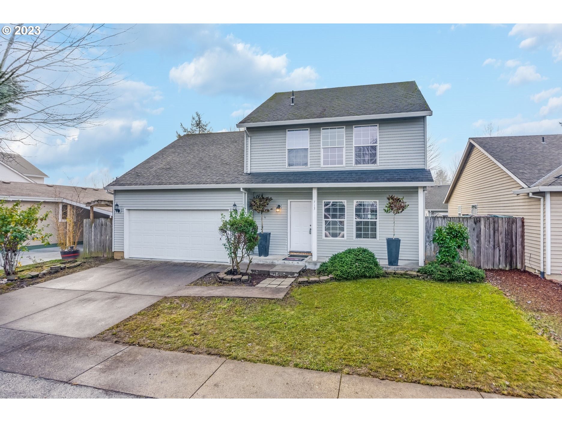 713 Northeast Mariners Loop Portland, OR 97211 - Photo 1 of 40 a front view of house with yard and outdoor seating