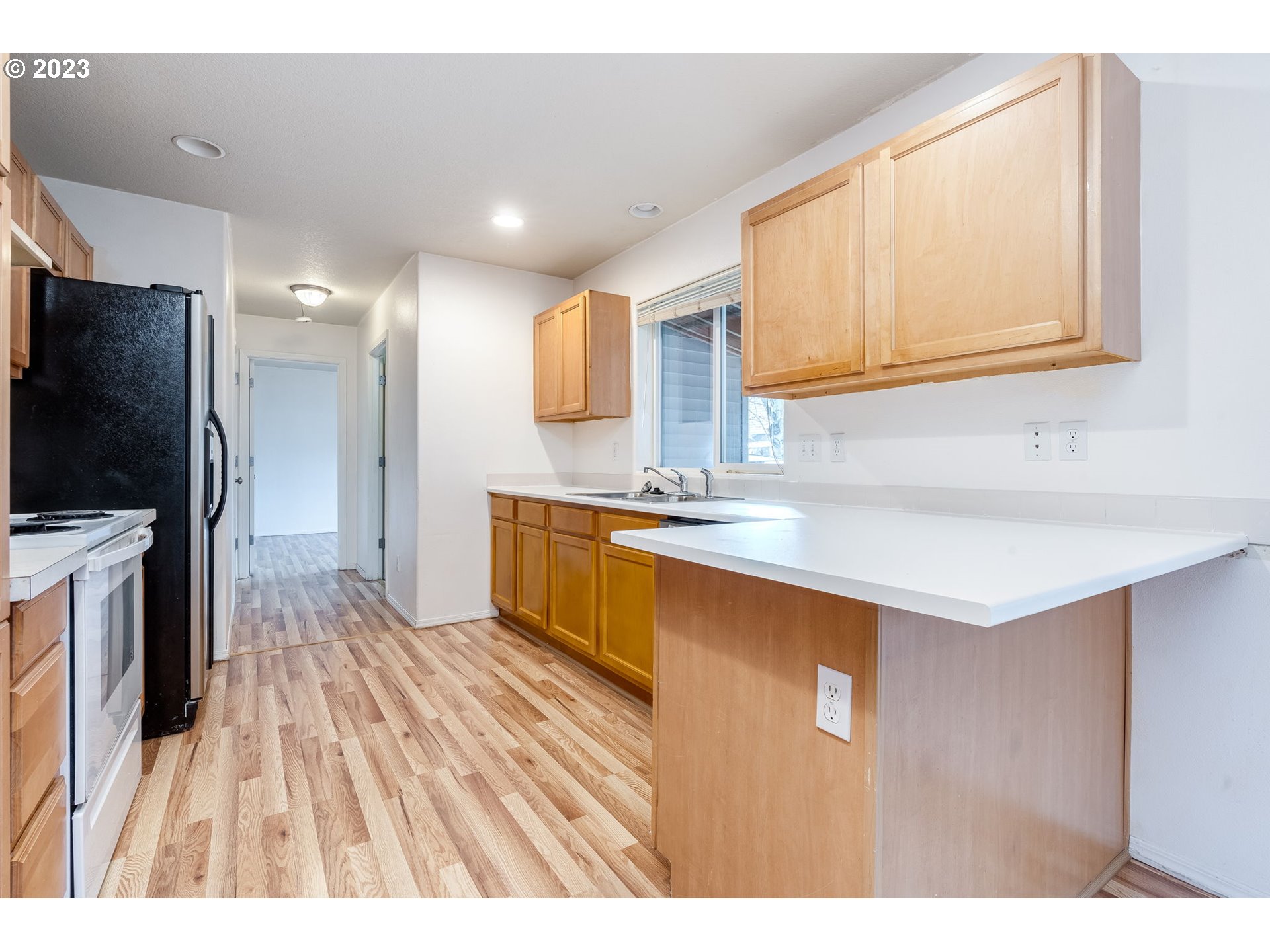 713 Northeast Mariners Loop Portland, OR 97211 - Photo 13 of 40 a bathroom with a sink a mirror and a bathtub
