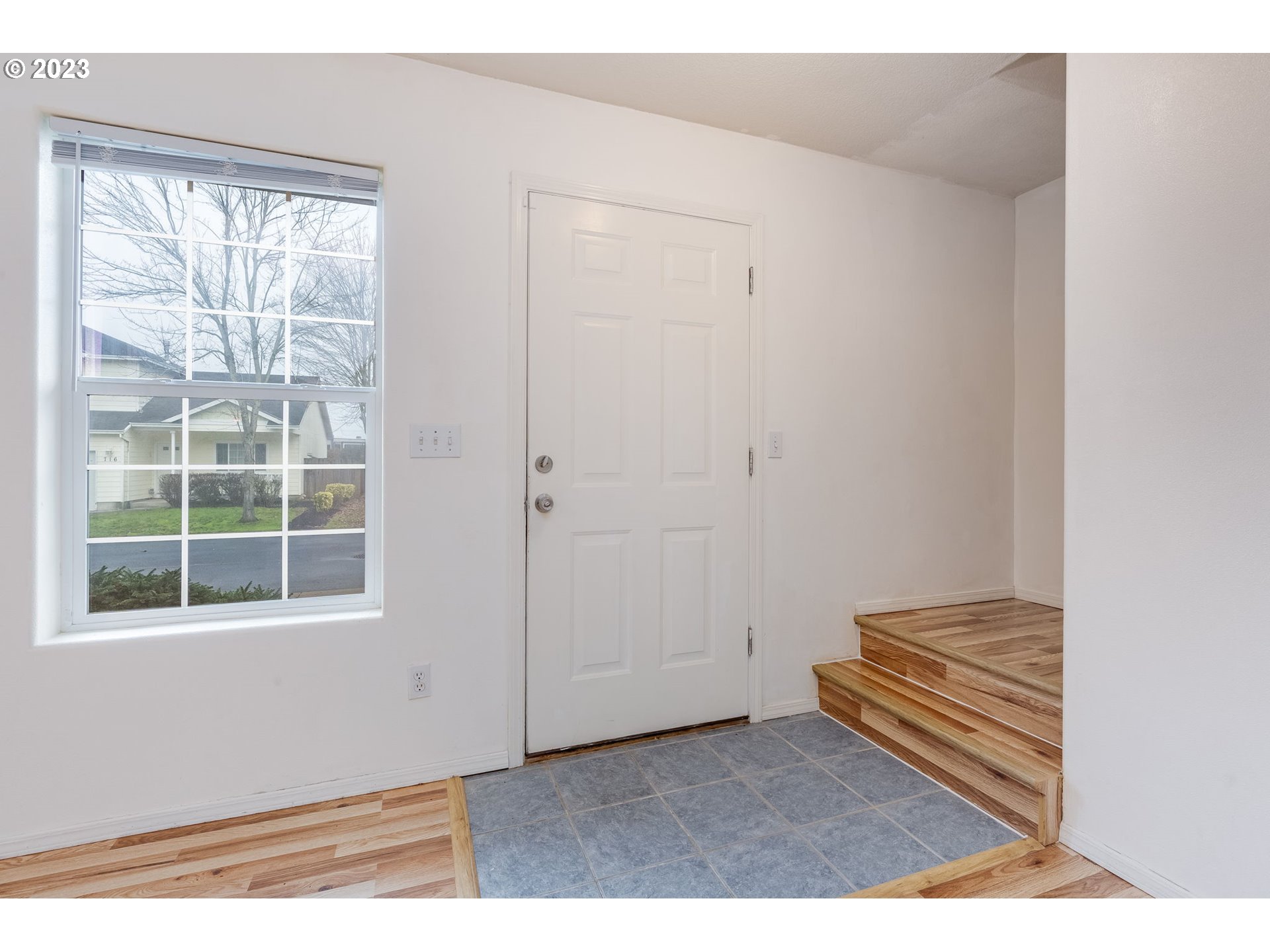 713 Northeast Mariners Loop Portland, OR 97211 - Photo 22 of 40 a view of wooden floor and windows in a room