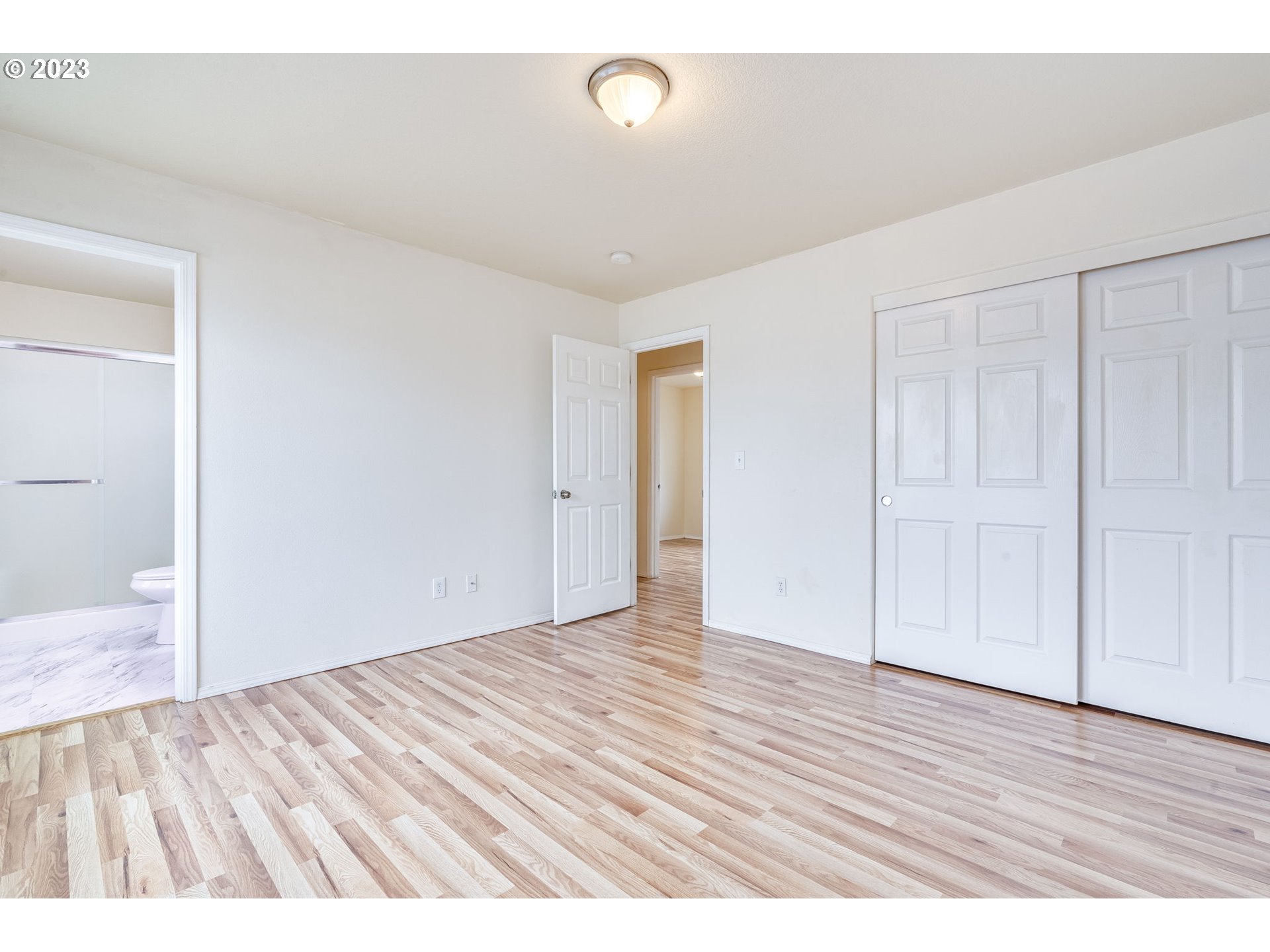 713 Northeast Mariners Loop Portland, OR 97211 - Photo 27 of 40 a view of an empty room with wooden floor