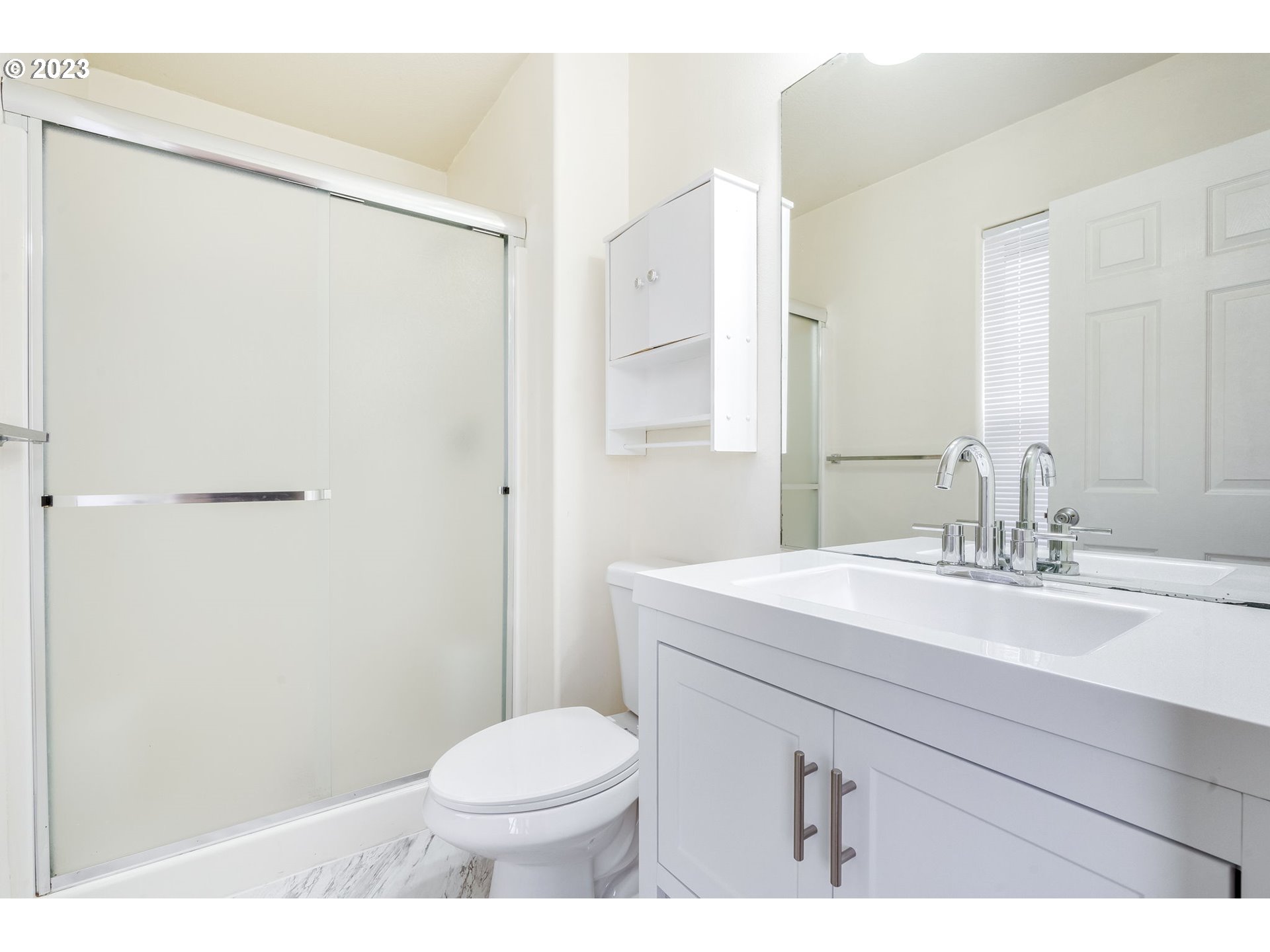 713 Northeast Mariners Loop Portland, OR 97211 - Photo 28 of 40 a bathroom with a sink a toilet a mirror and shower