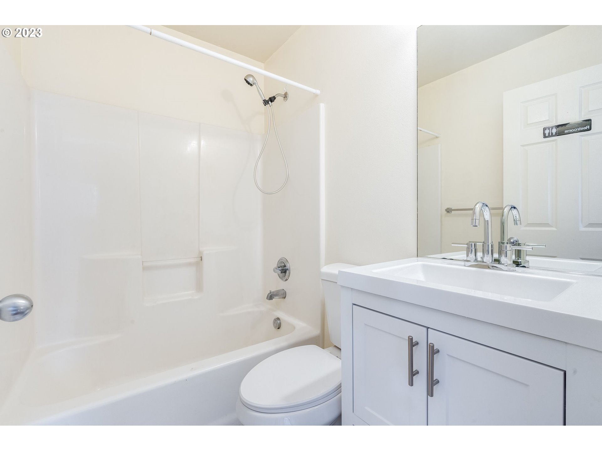 713 Northeast Mariners Loop Portland, OR 97211 - Photo 31 of 40 a bathroom with a sink toilet a shower and a mirror